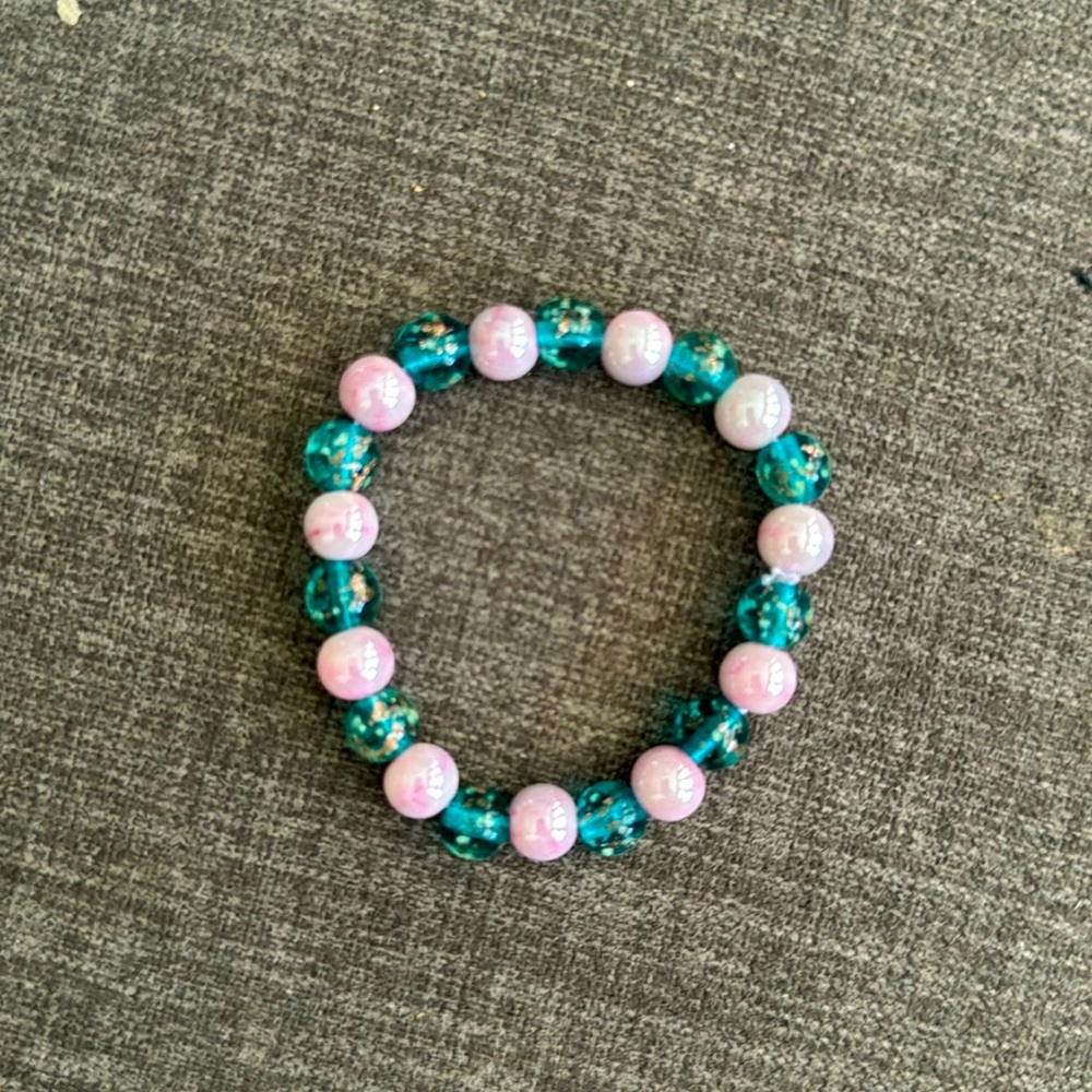 Handmade bracelet with pink glass and green glitter glass glow beads